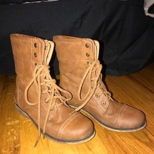 Tan boots with a pull down sequence top.